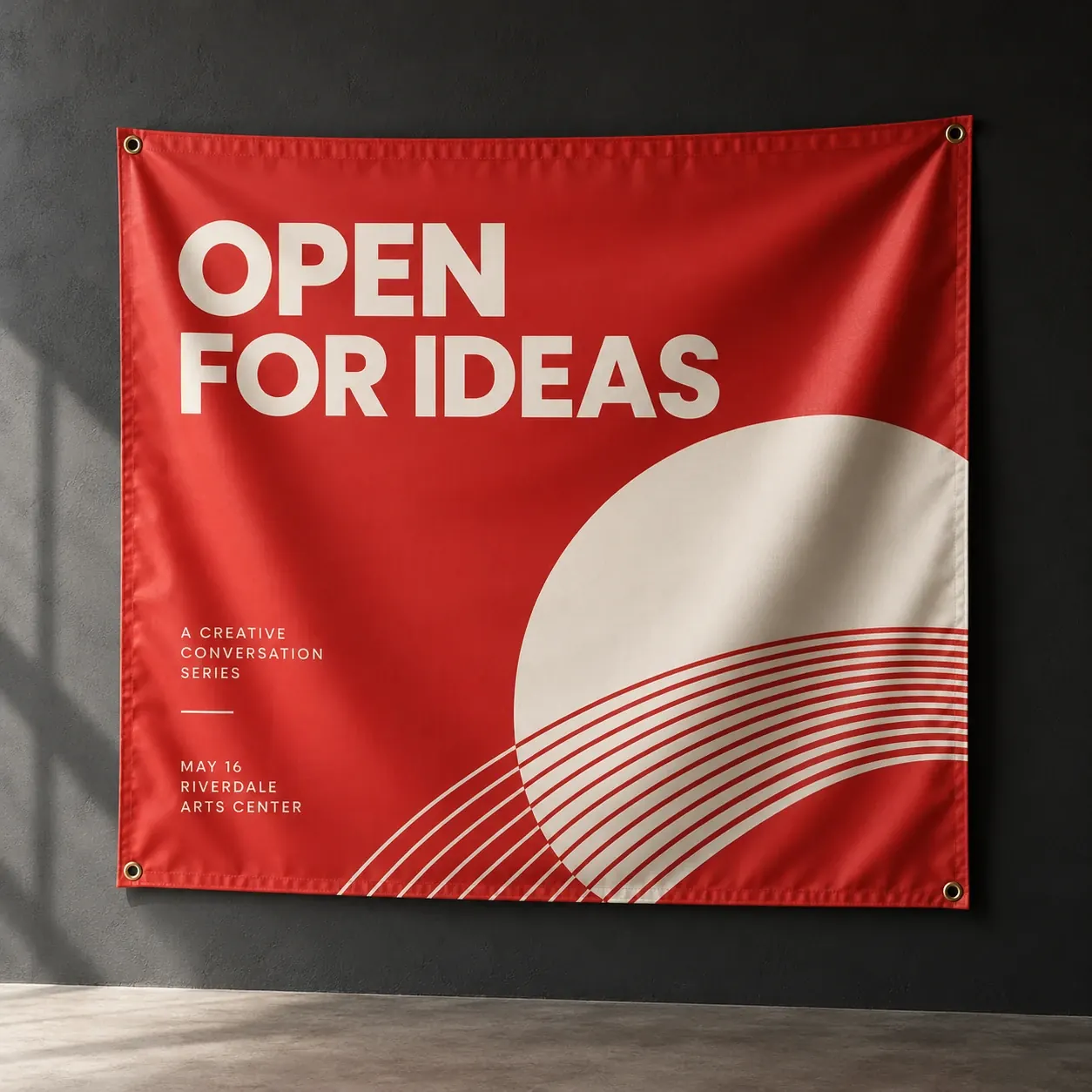 Printed banners shown as a physical product in charcoal, red and warm white