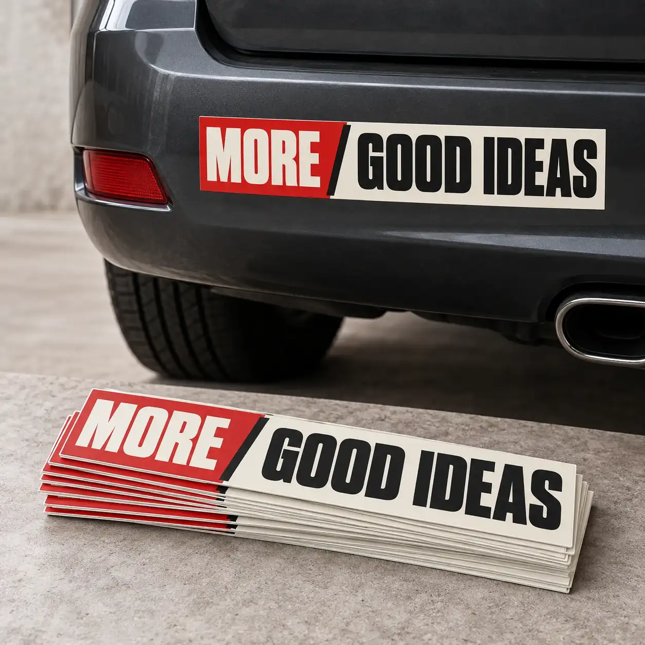 Printed bumper stickers shown as a physical product in charcoal, red and warm white