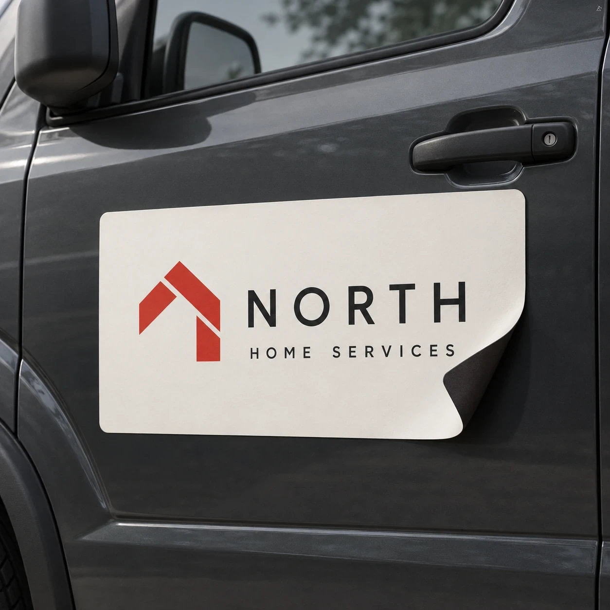 Printed vehicle magnets shown as a physical product in charcoal, red and warm white