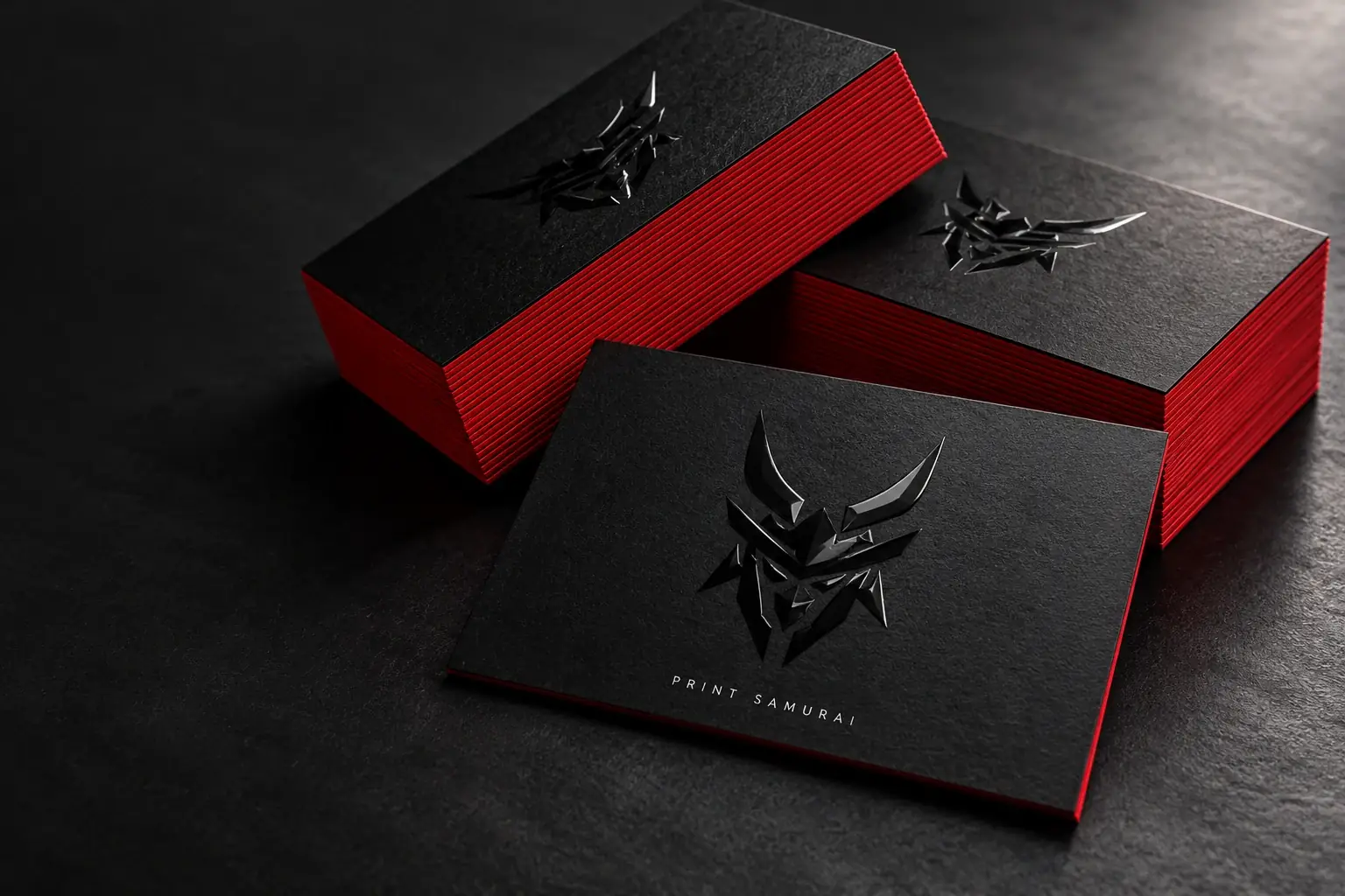 Thick charcoal business cards with red painted edges
